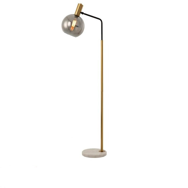 Lampadaire design en métal doré avec base en marbre et abat-jour en verre LEXY